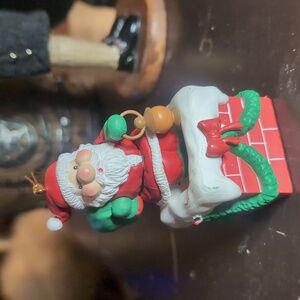 AVAILABLE - VTG 1991 National RENNCO Ornament w/ Santa going down chimney. 3" T